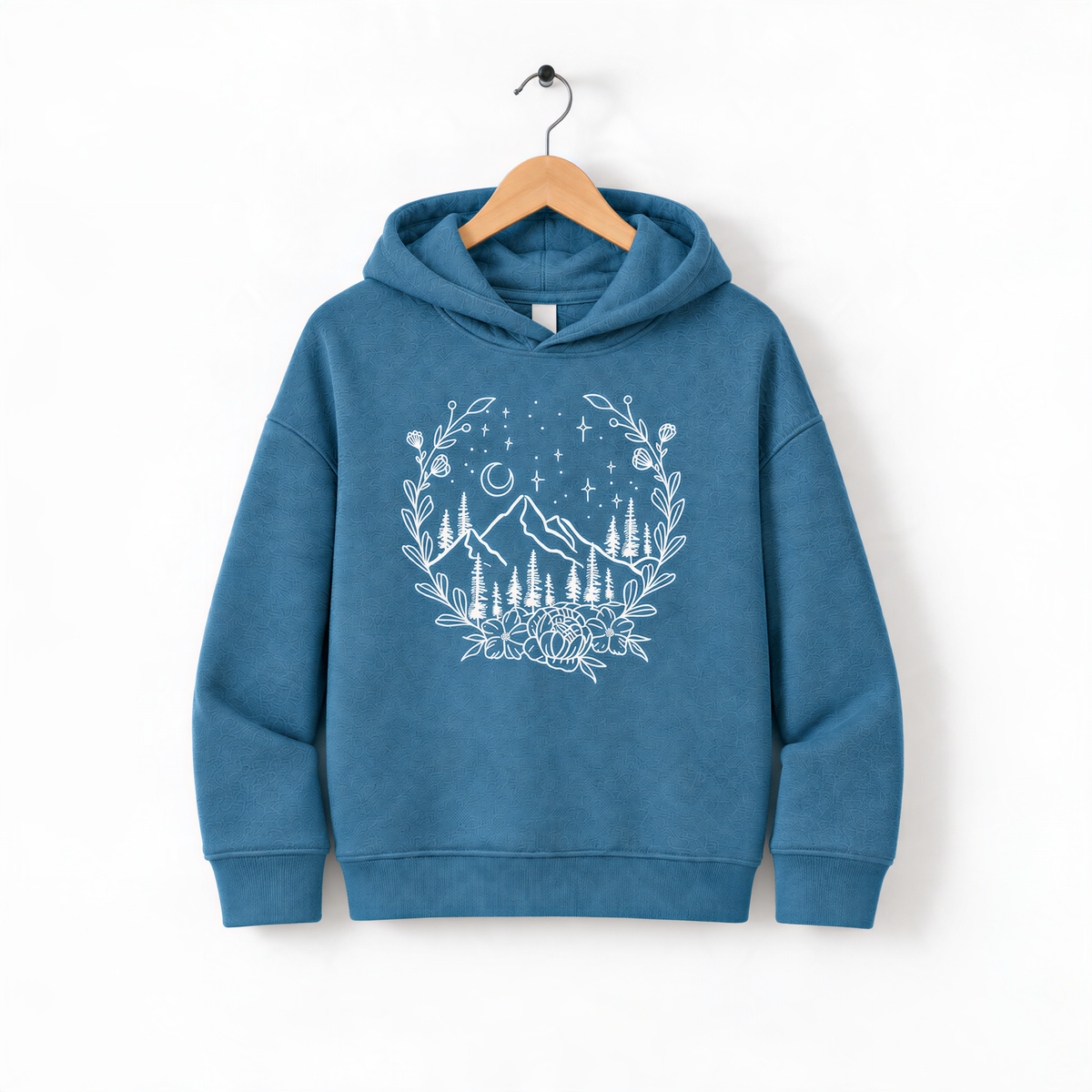 A blue hoodie with a white floral design on the front, hanging on a wooden hanger.