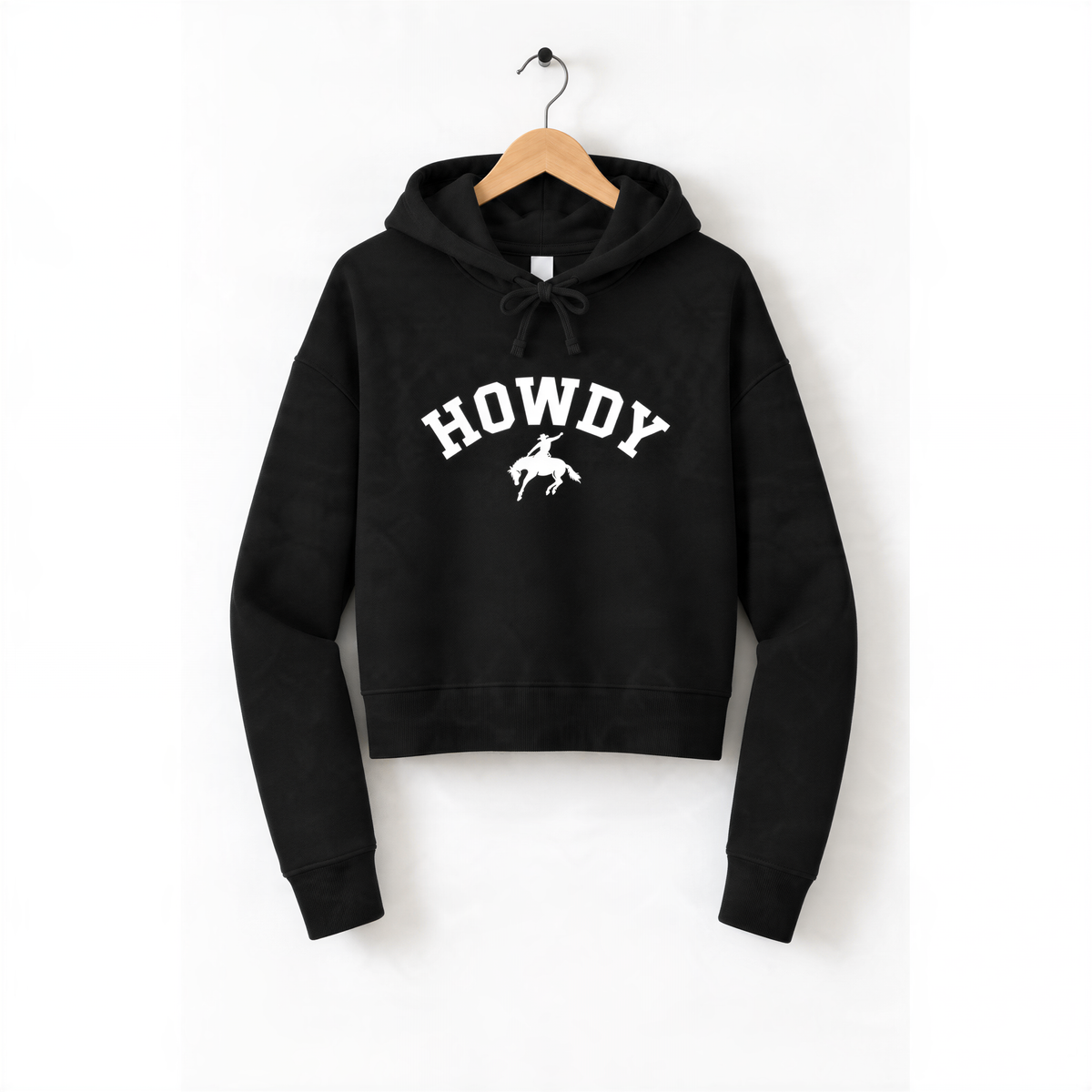 A black hoodie with the word "HOWDY" printed on it, hanging on a wooden hanger.