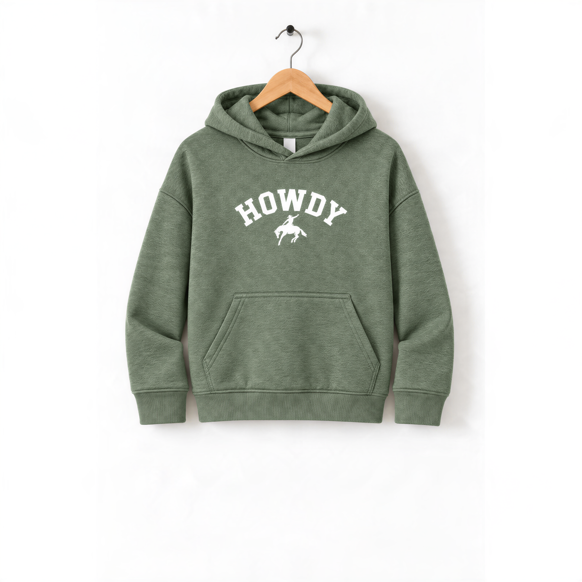 A green hoodie with the word "HOWDY" printed on it, hanging on a wooden hanger.