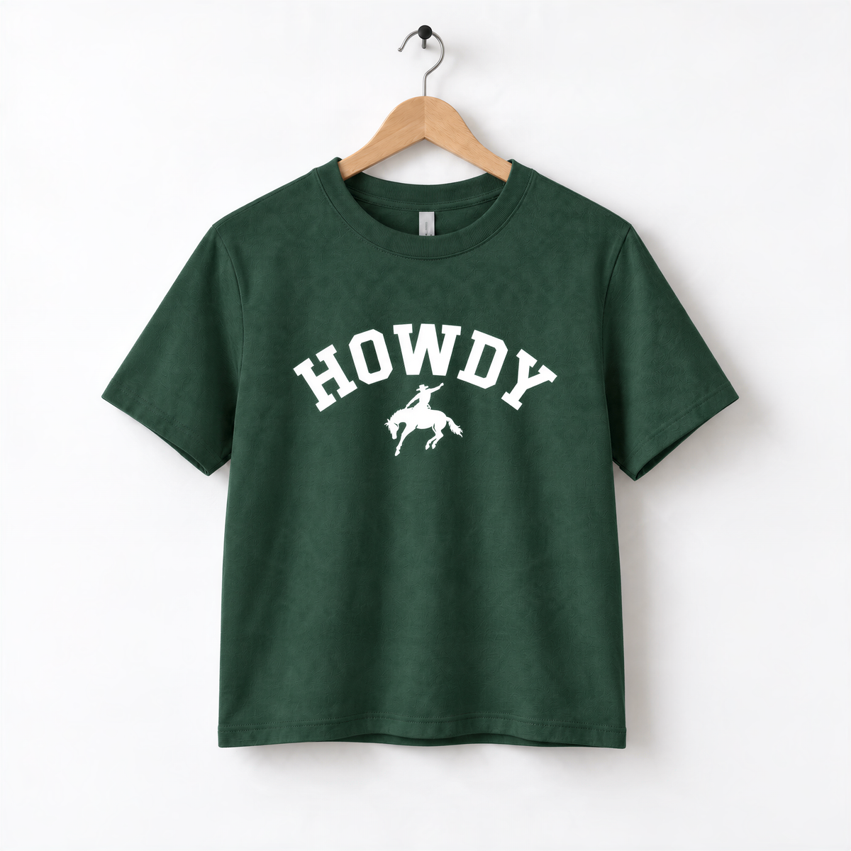 A dark green t-shirt with the word "HOWDY" printed in white letters.