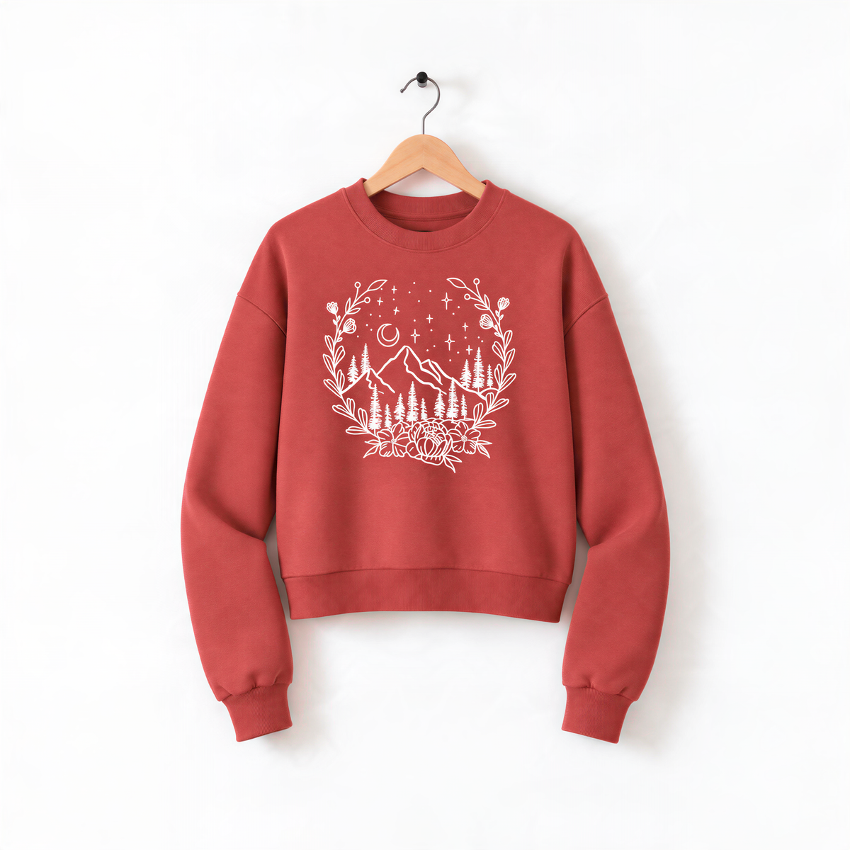 A red sweatshirt with a white floral design on the front, hanging on a wooden hanger against a white background.
