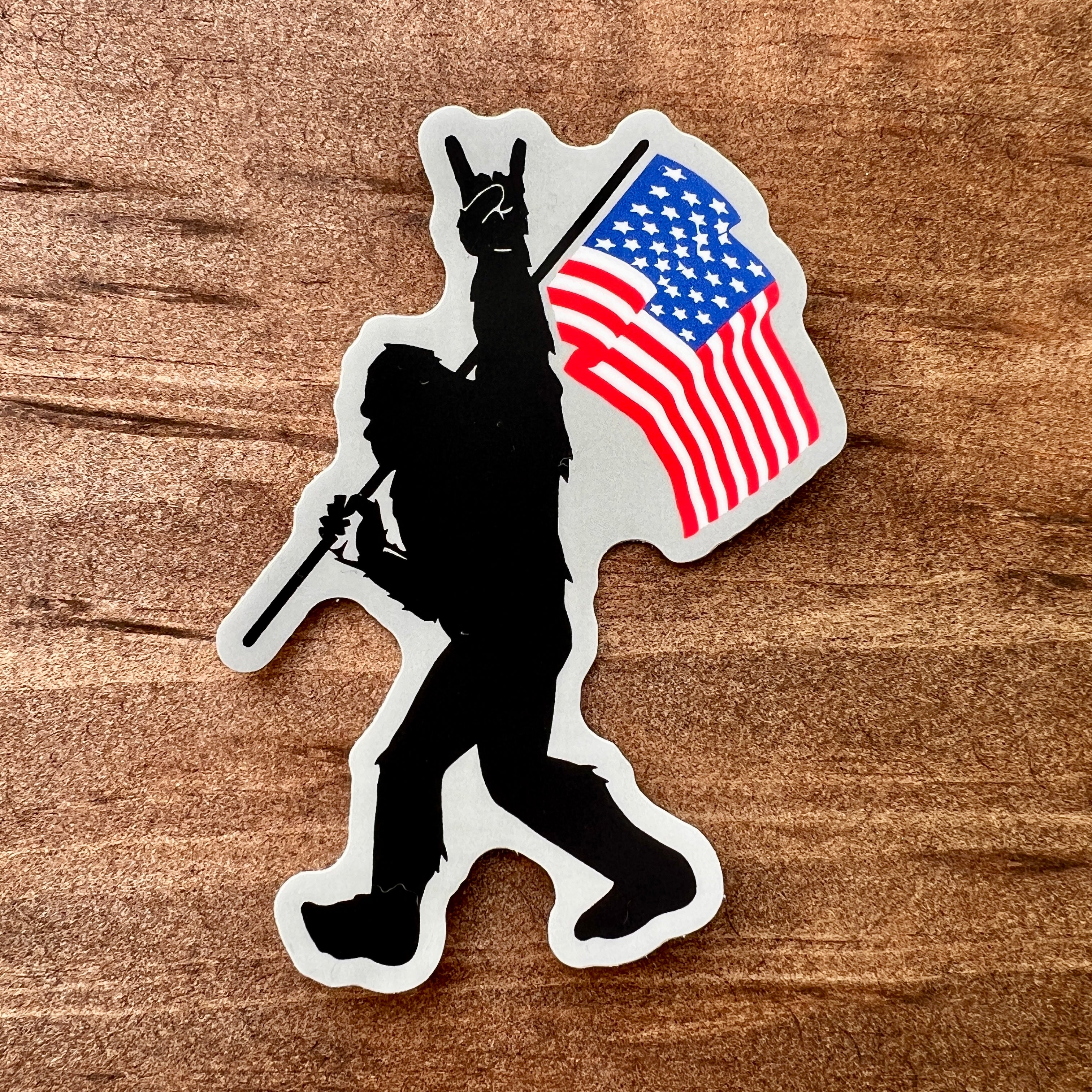 Bigfoot Carrying Flag Sticker-Sticker-208 Tees- 208 Tees, A Women's, Men's and Kids Online Graphic Tee Boutique, Located in Spirit Lake, Idaho