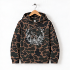 A camouflage hoodie with a white floral design on the front.