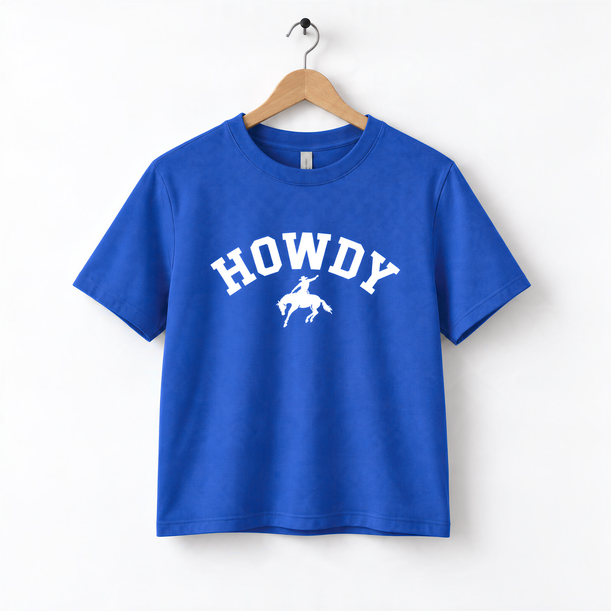 A blue t-shirt with the text "HOWDY" printed on it, along with a graphic of a cowboy.
