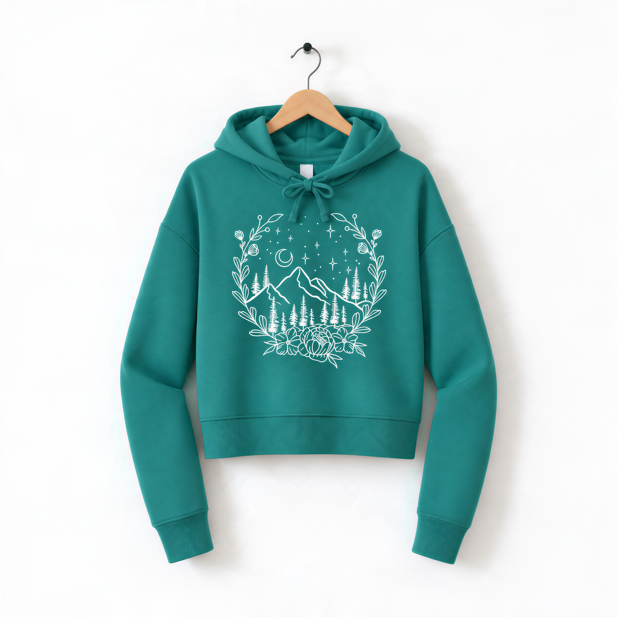 A teal hoodie with a white floral design on the front, hanging on a wooden hanger against a white background.