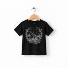 A black t-shirt with a white graphic design depicting a mountain landscape with trees, flowers, and stars.