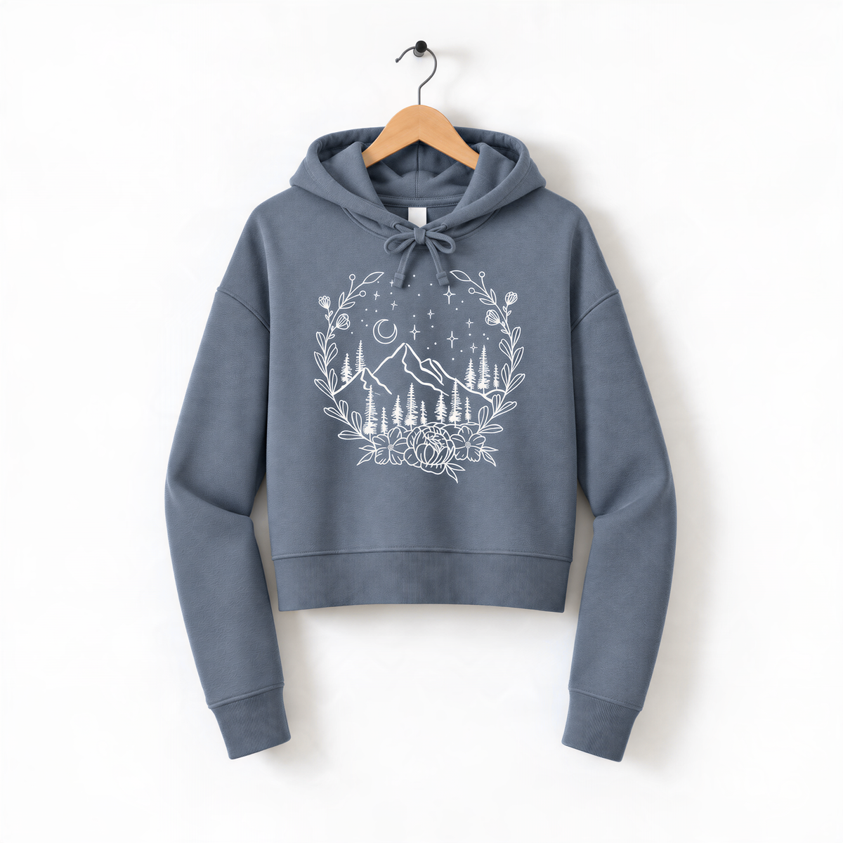 A gray hoodie with a white graphic design depicting a mountain landscape with trees, flowers, and a starry night sky.