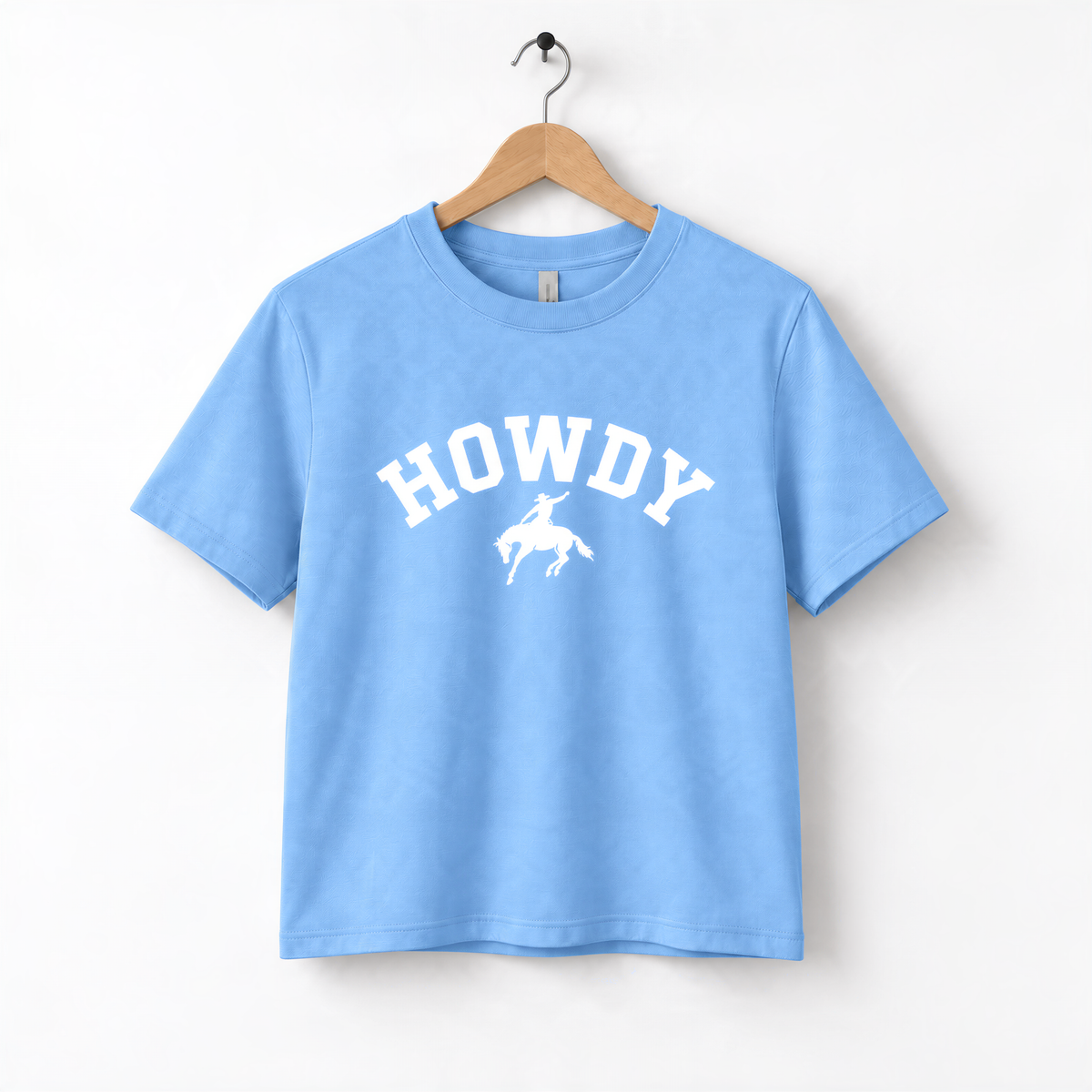 A light blue t-shirt with the text "HOWDY" printed on it.