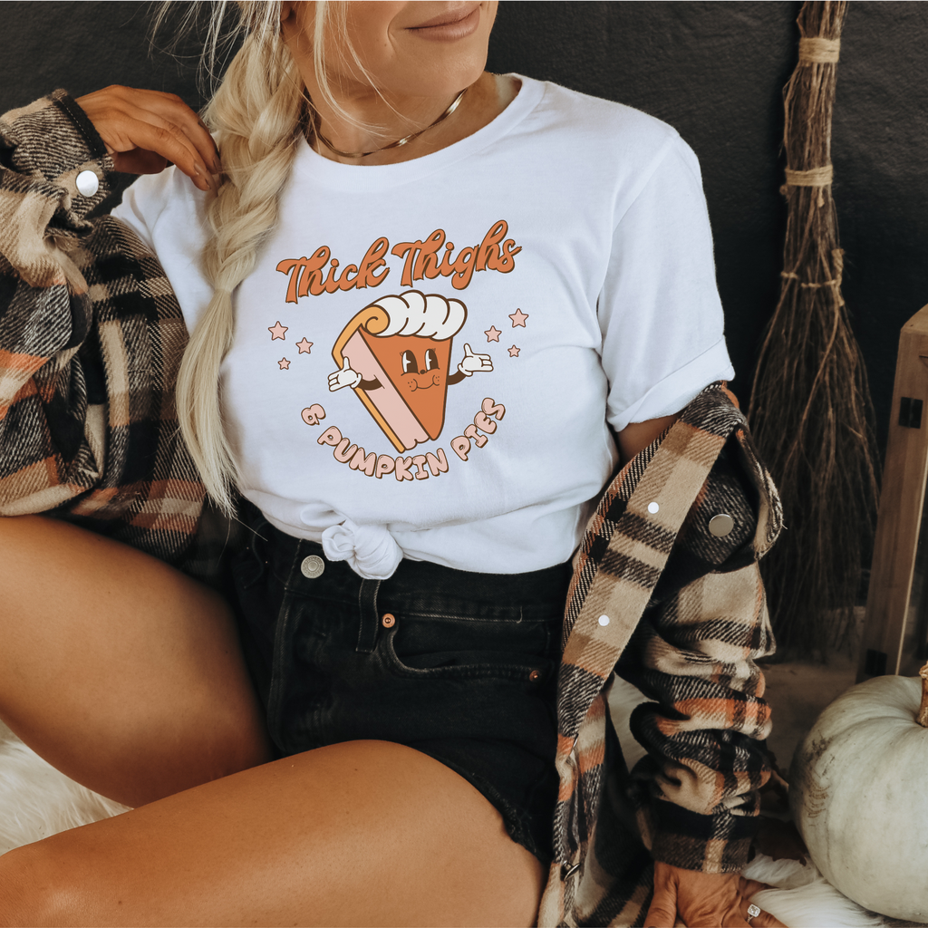 Thanksgiving graphic tee with smiling pumpkin pie slice and cutesy lettering

