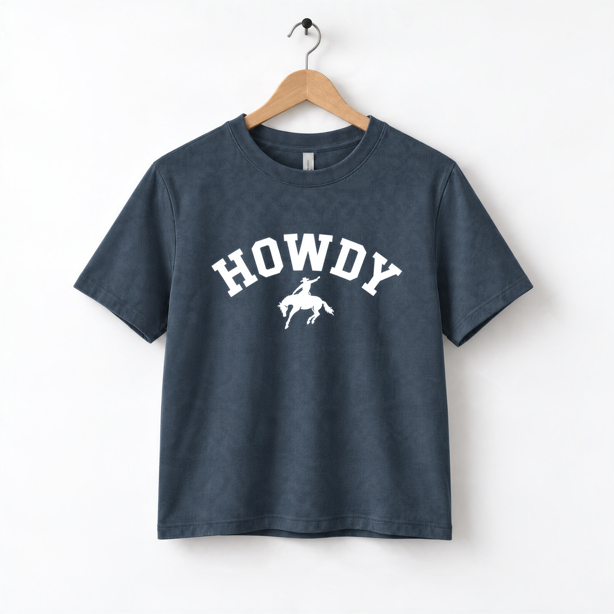 A navy blue t-shirt with the text "HOWDY" printed on it, along with a graphic of a cowboy.