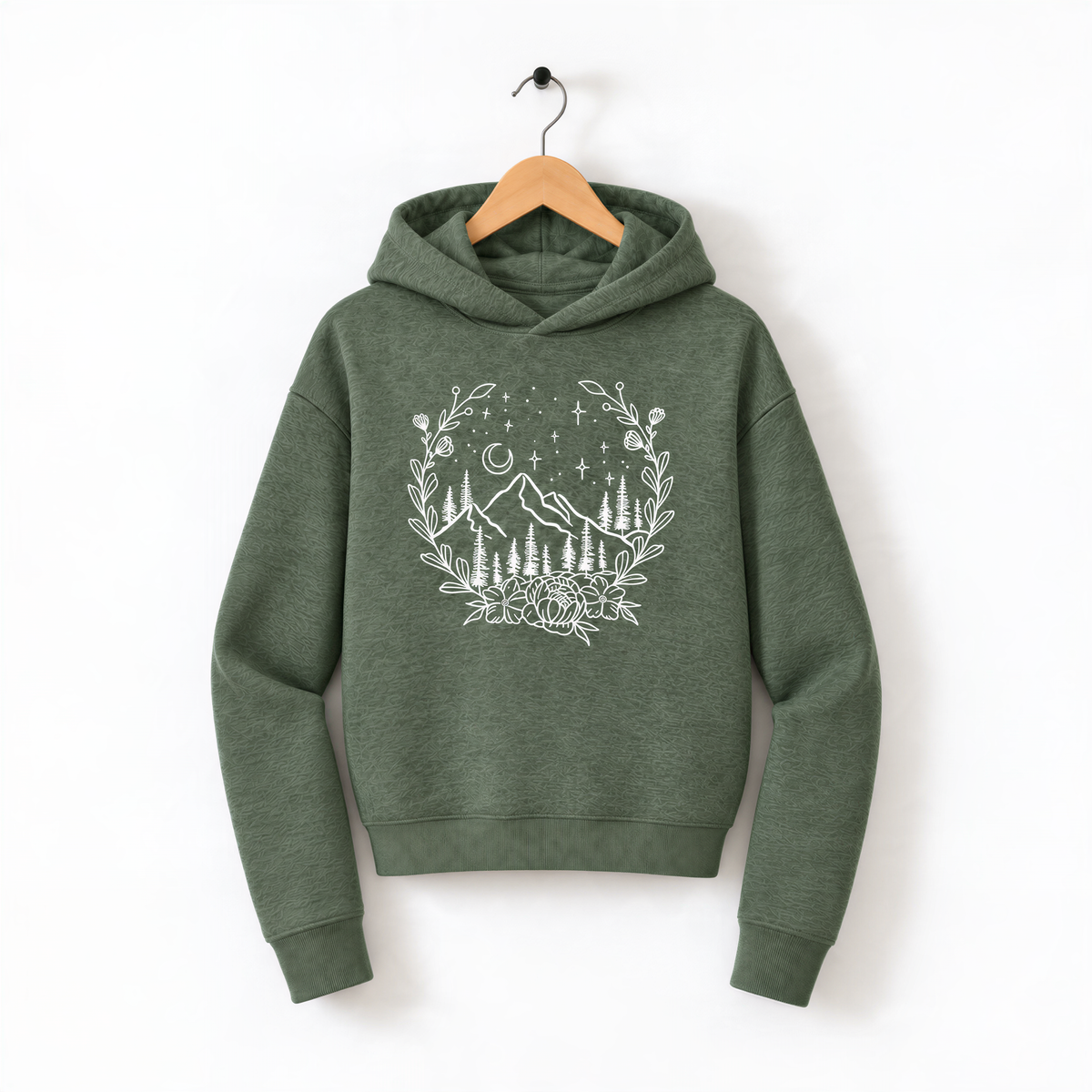A green hoodie with a white floral design on the front, hanging on a wooden hanger against a white background.