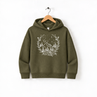 A green hoodie with a white floral design on the front, hanging on a wooden hanger against a white background.