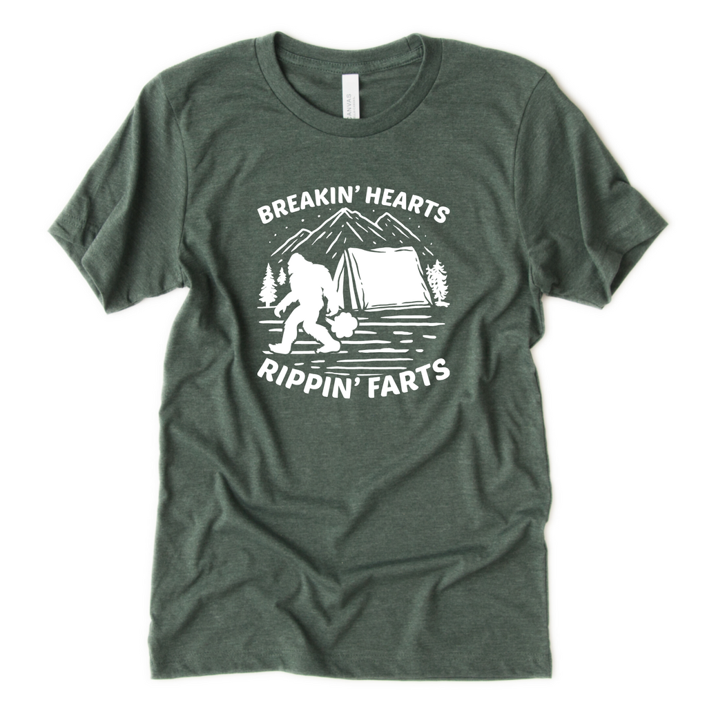 Funny Bigfoot t-shirt with camping scene and words “Breakin Hearts and Rippin Farts”
