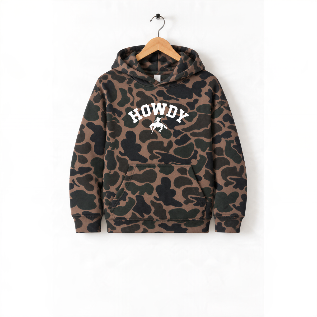 A camouflage hoodie with the word "HOWDY" printed on it, hanging on a wooden hanger.