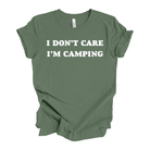 Green t-shirt with 'I DON'T CARE I'M CAMPING' text on a white background