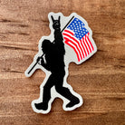 Bigfoot Carrying Flag Sticker-Sticker-208 Tees- 208 Tees, A Women's, Men's and Kids Online Graphic Tee Boutique, Located in Spirit Lake, Idaho